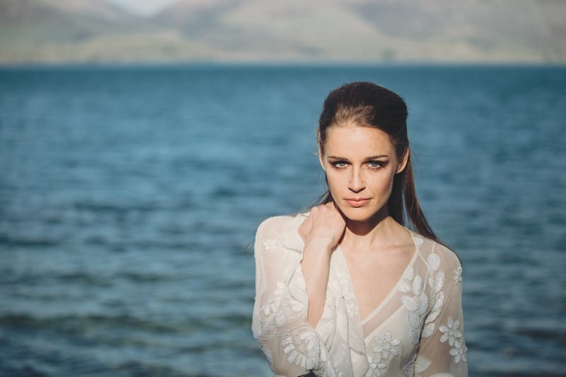 Wedding editorial with bride wearing Rue De Seine Zeppelin wedding gown at Bobs Cove Queenstown New Zealand