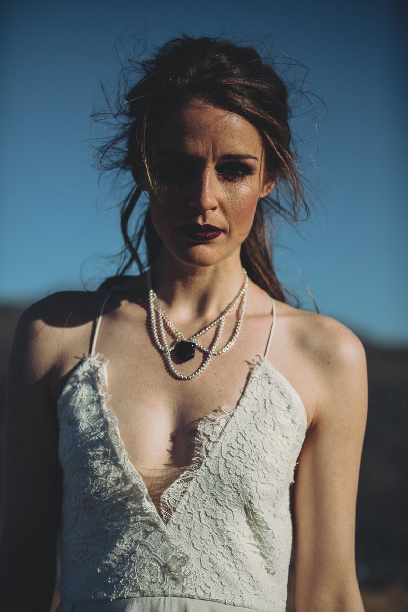 NZ High Country wedding venue with views of The Remarkables and bride wearing Rue De Seine Mackenzie gown with styling by Colour Me Happy Weddings