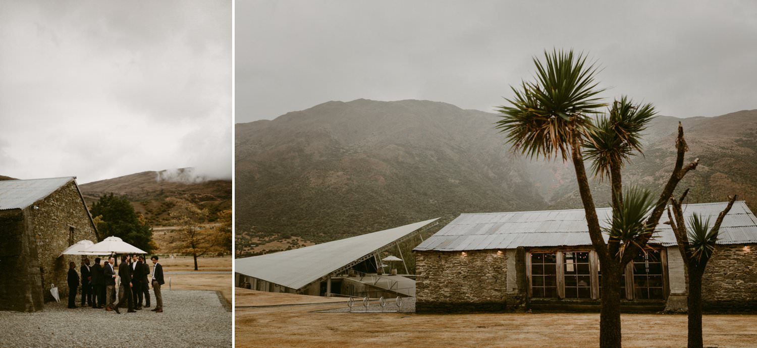 Stone wool shed with Peregrine Winery Falcon Wing shelter and Central Otago mountains in background as part of winery wedding