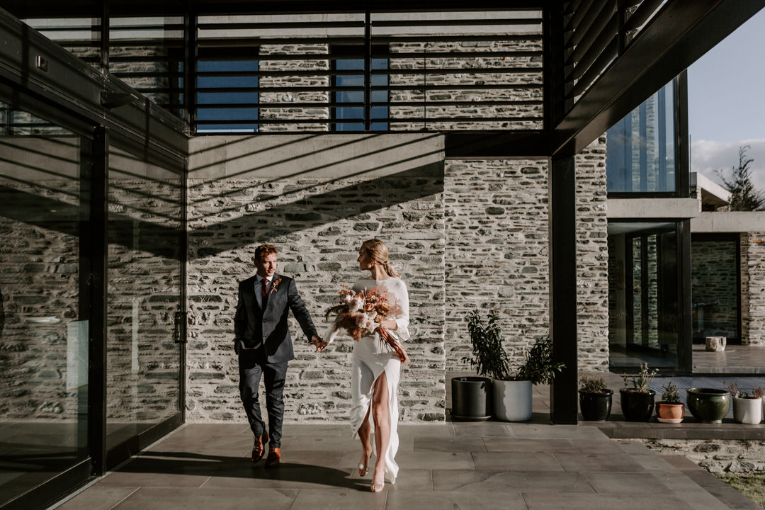 Bride in Karen Walker Ritual Gown at Modern Elopement at Jacks Retreat Elopement Wedding in Queenstown, New Zealand by Dawn Thomson Photography