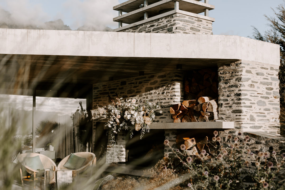 Fire place and roaring fire at Jacks Retreat Elopement Wedding in Queenstown, New Zealand by Dawn Thomson Photography
